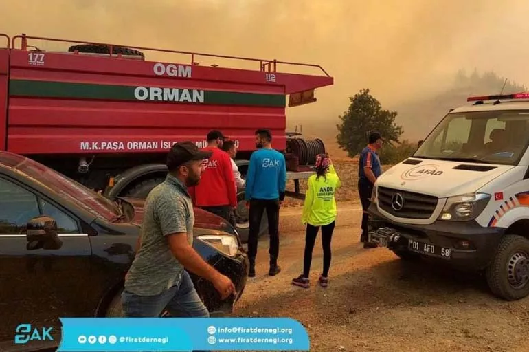Suriyeliler yardım için yangın bölgesine koştu
